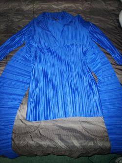 Royal Blue Pleated Long-sleeve top with a collared V-neckline and distinct side draping wrap belt. Size 6