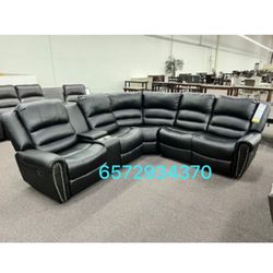 Black leather sectional sofa with recliners