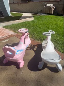Two ride-on wiggle cars, $10 for both.
