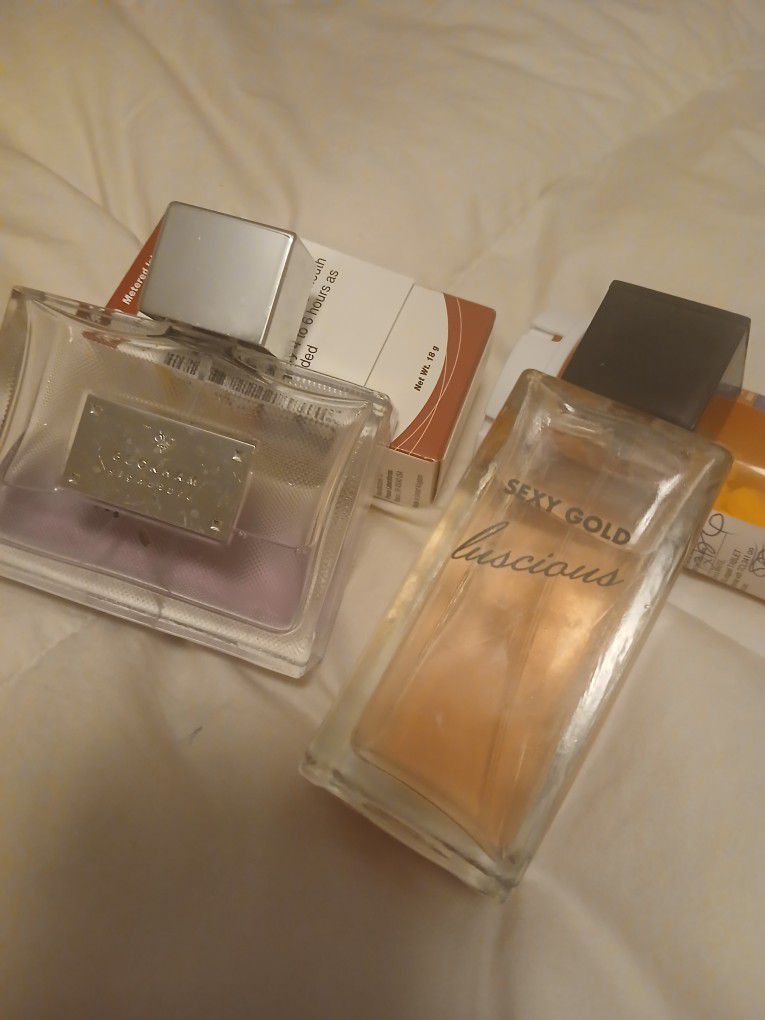 Woman's perfume brand new men's Cologne.Half full