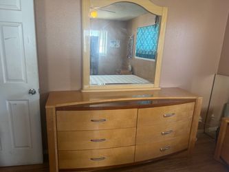 Dresser with mirror. And 2 night stands.