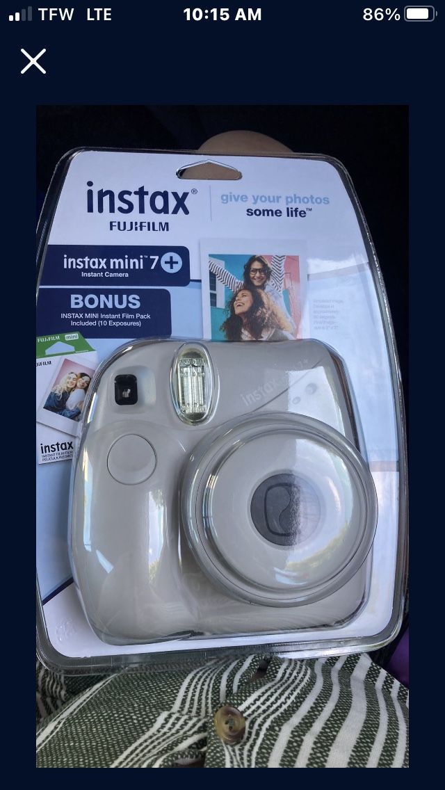 Poloroid Camera (includes batteries and 10 pictures/film