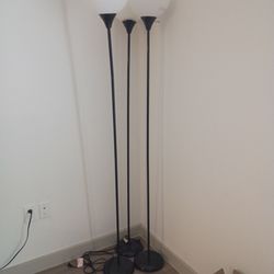 3 black stand up lamps