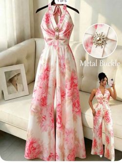 Pink & white floral jumpsuit with halter neck and wide leg #florals #halter.