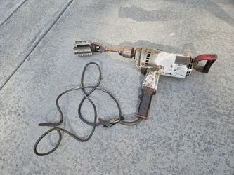 Milwaukee Super Hole Shooter Drill with a vintage cylinder engine hone attachment