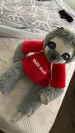 Sloth plushy with red lobster necklace