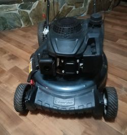 Troy bilt 21 " 5.5 h/p high wheel push mower ( like new)