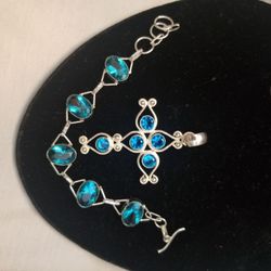 Beautiful solid 925 silver cross necklace and bracelet set with london blue topaz.