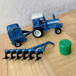 ERTL Ford TW-20 1/64 Die Cast Blue Farm Tractor W/ Bailer, Plow & Bail Of Gras