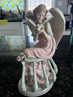 Porcelain Angel Figurine with Dove and Flowers
