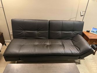 Black futon with built-in outlets