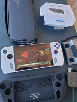 $520! Firm New With Case New With plastic Case. 1000GB 1TB Asus Rog Ally Limited Edition Z1 Extreme 1TB with all You See. Trade for PS5 Pro Or slim wi