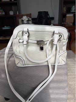 MC white faux leather handbag.