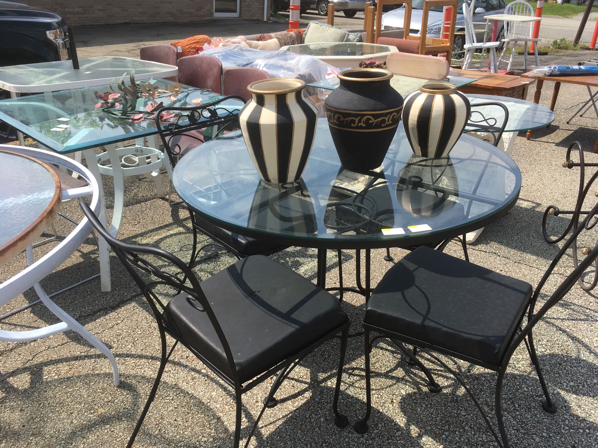 5pc. Black wrought iron table 4 chairs glass top