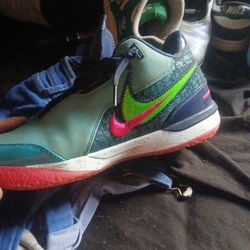 Size 11  Nike LeBron NXXT Gen AMPD basketball shoes in the "South Beach" colorway, featuring dusty cactus, green strike, midnight navy, and pink accen