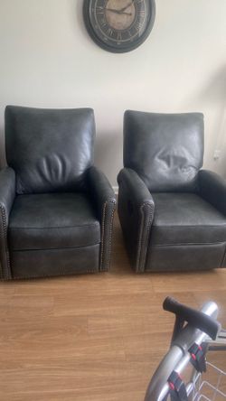 Two swivel rocker recliners. Gray.