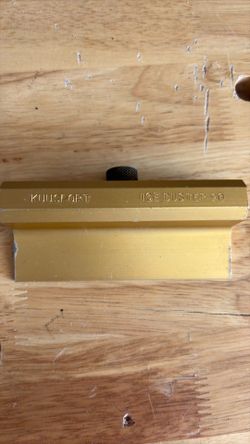 This is a Kuu Sport Ice Buster 90, specifically designed for sharpening ski or snowboard edges.The tool is constructed from gold-colored aluminum and