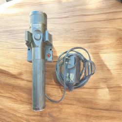 Streamlight Stinger LED rechargeable flashlight with its charger