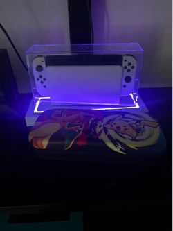 Nintendo Switch OLED with case and games