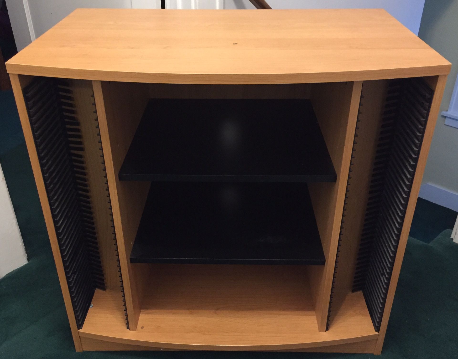 Free Entertainment Center with adjustable shelves and lots of slotted space for DVDs, CDs, and other storage