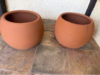 Two terracotta clay pots