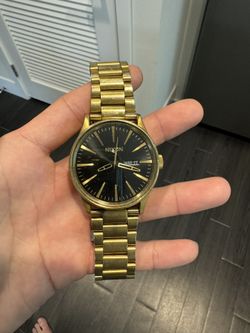 Gold Nixon Watch With Black Dial