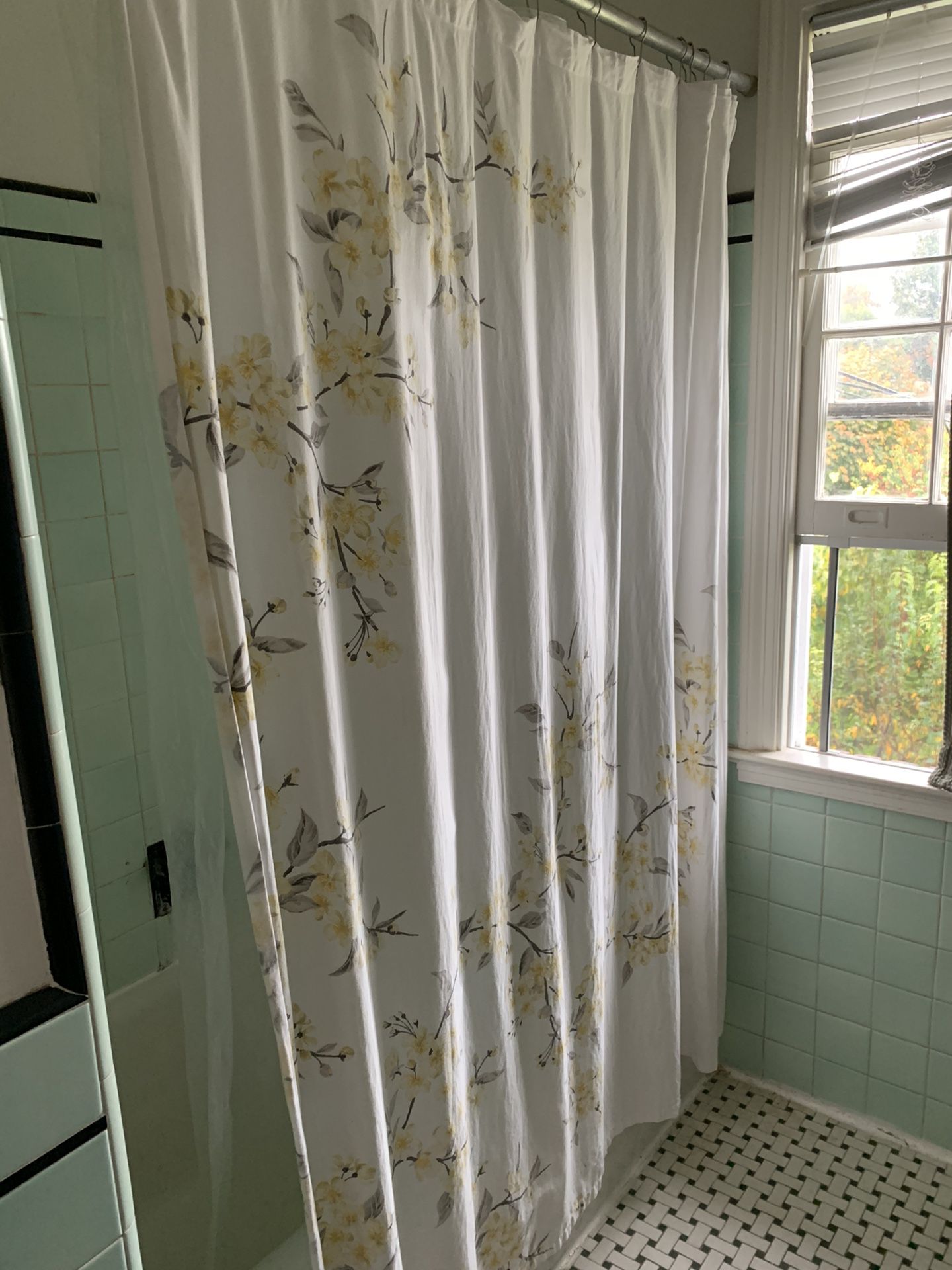 White shower curtain with yellow flowers