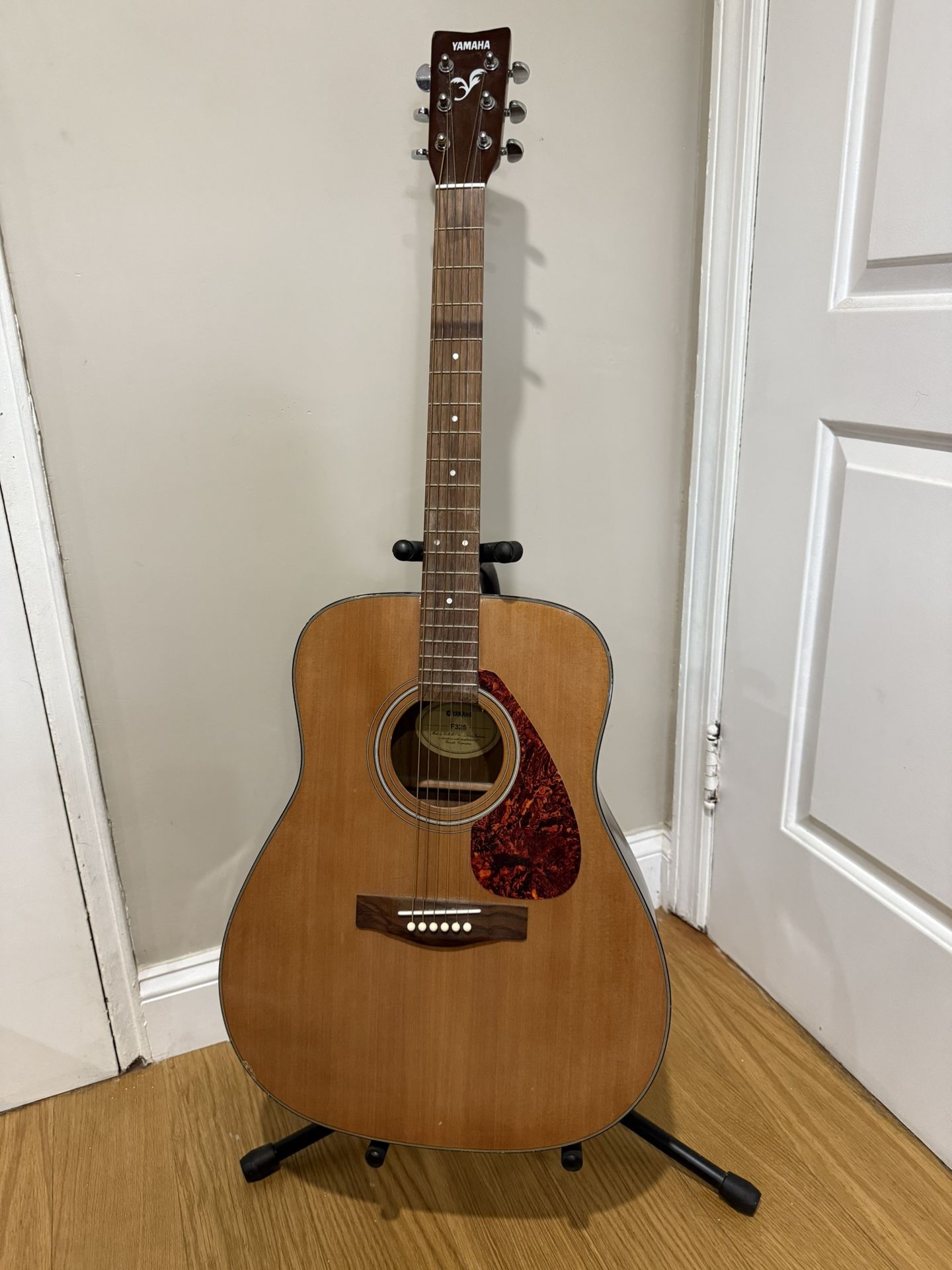 Yamaha full size Acoustic guitar with stand and capo