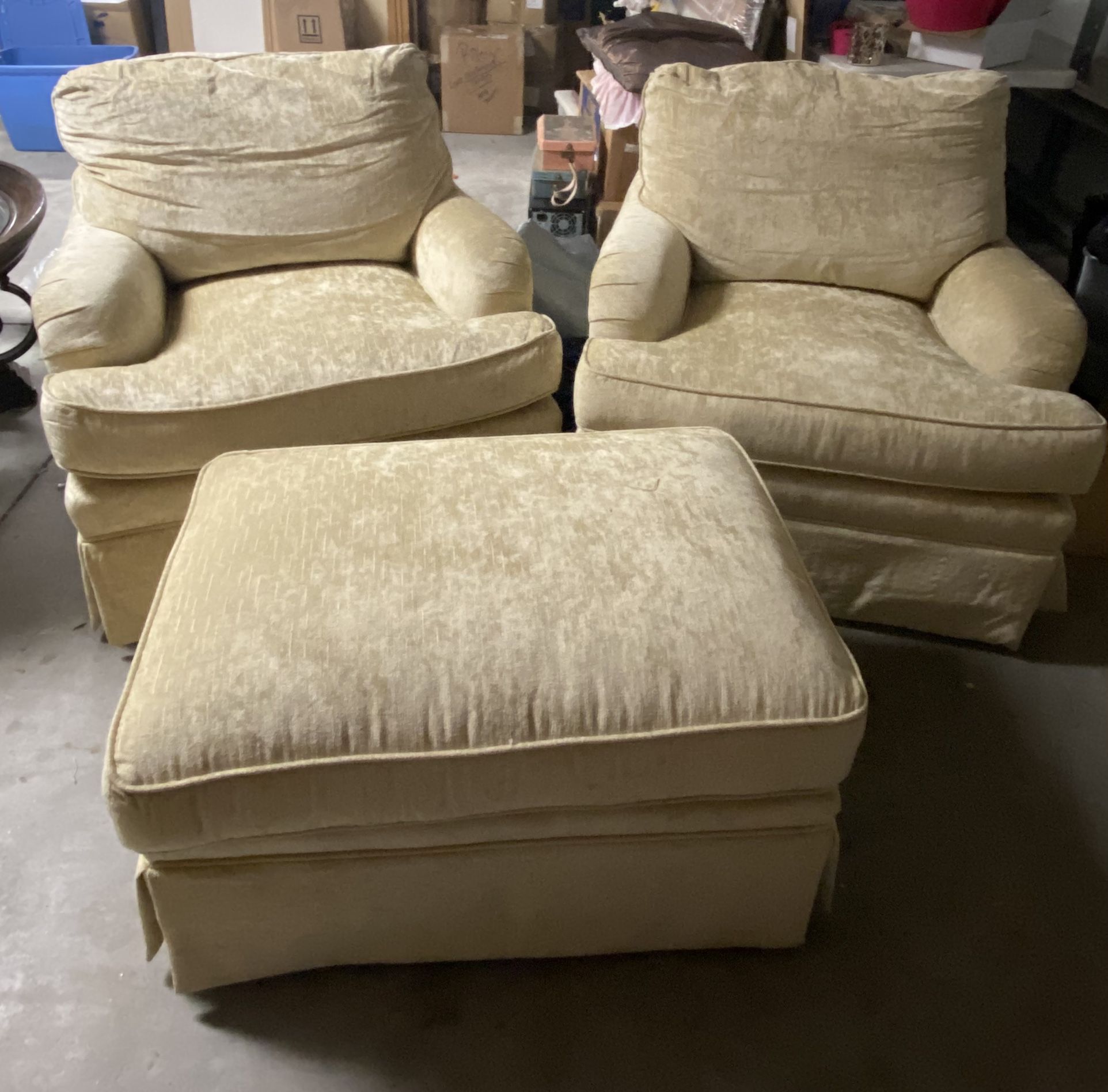 Two Swivel Chairs And An Ottoman