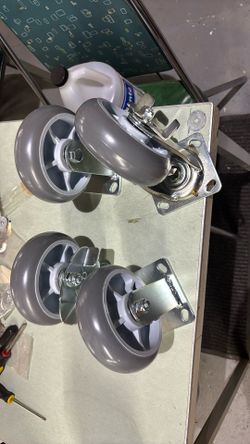 heavy-duty swivel caster wheel with a brake mechanism and a gray thermoplastic rubber