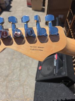 “Squier by Fender,”