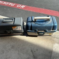 Fishing tackle boxes with some gear in them