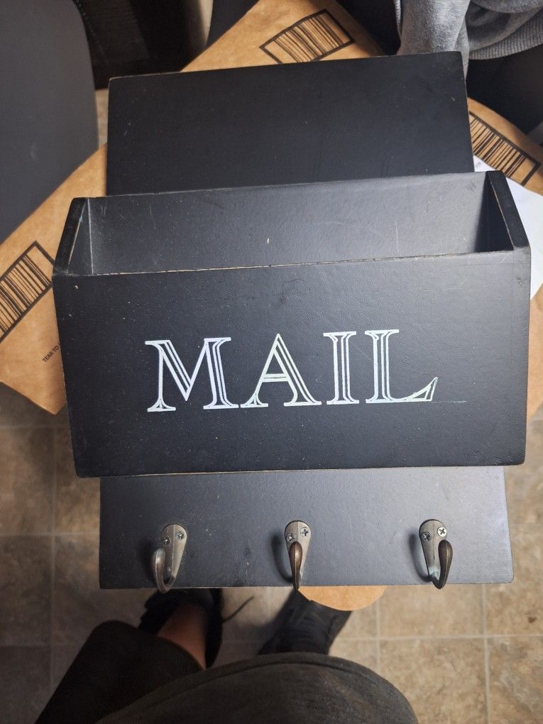 10" X 33" X 14" WOODEN MAIL BIN WITH HOOKS.
