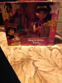 DORA ROCKS SING ALONG DOLL