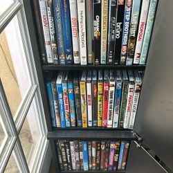 64 DVD Movies Whit movie Shelf $50 obo.
