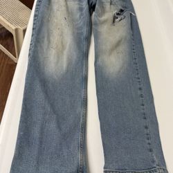 Worn but clean blue jeans, slim straight, 32” wide x 30” long. 