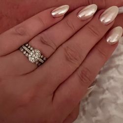 Diamond engagement ring, and two wedding bands