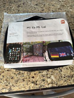 Mi Ya Mi Lai enamel pin binder for collectors.