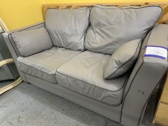 Gray leather loveseat