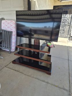 Tv stand and 55inch samsung smart tv model 6900