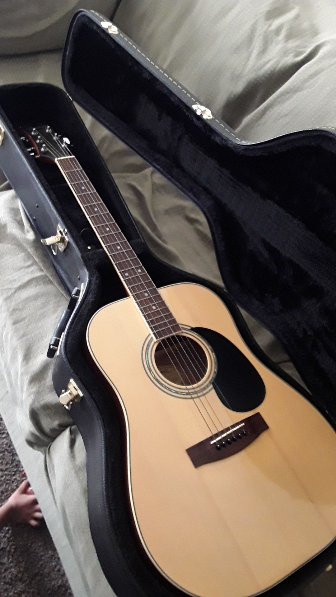 Acoustic guitar with case and strap