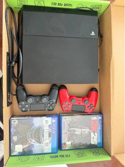 PS4 with 3 controllers and 4 games included