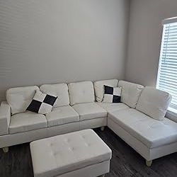 New White Leather Sectional And Ottoman 