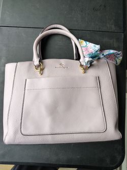 Nanette Lepore blush pink handbag features a pebbled faux leather