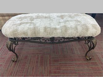 Faux fur bench on intricate wrought iron base