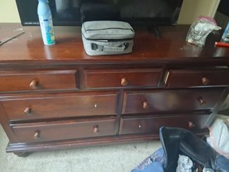 Brown dresser with yours with mirror two drawer knobs are missing, but you could buy them at Home Depot or Walmart