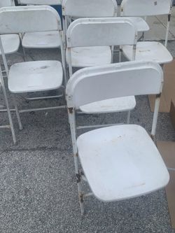 Used white folding chairs s,a,l,e