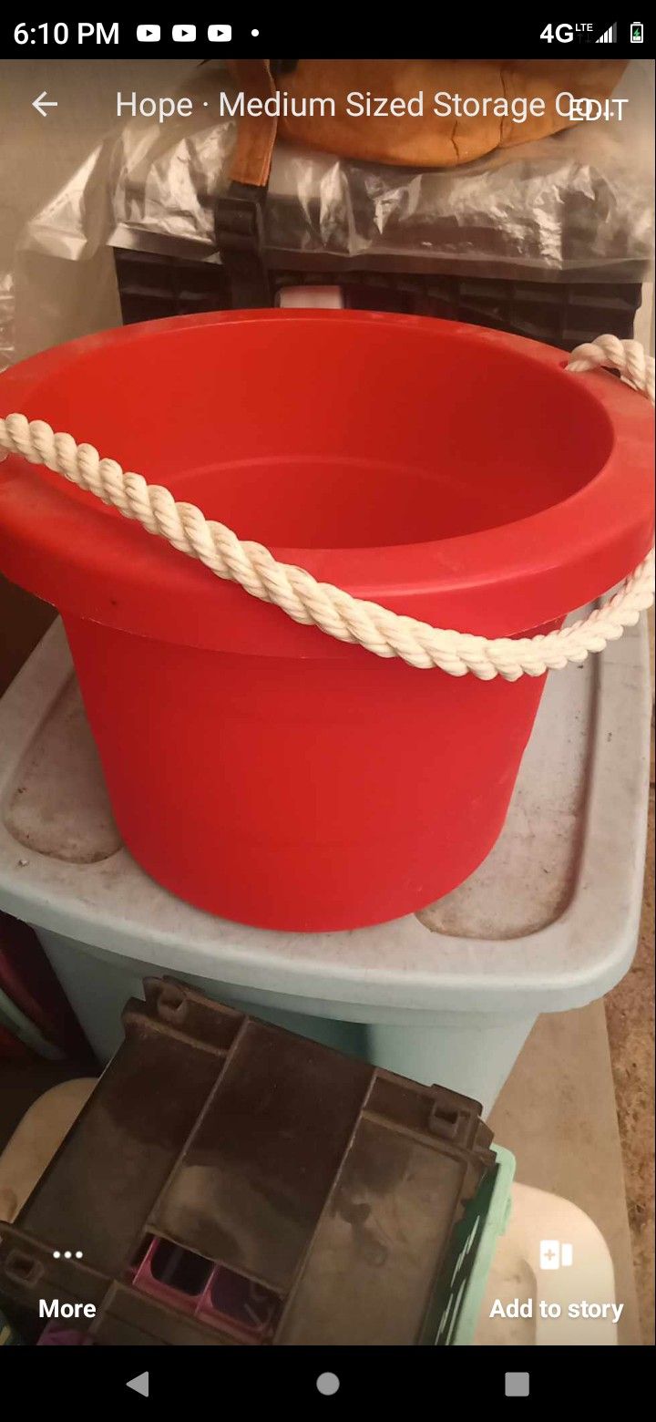 A Red Bucket W/ A Rope Handle