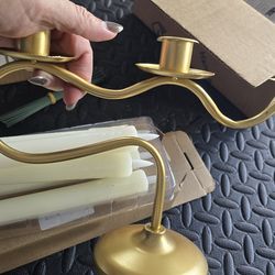 2  vintage looking candle holders with candles  gold