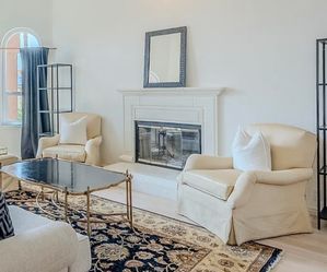 2 gold arm chairs